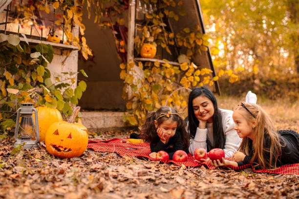 istock Mother with daughters have fun moments for Halloween 1431007852