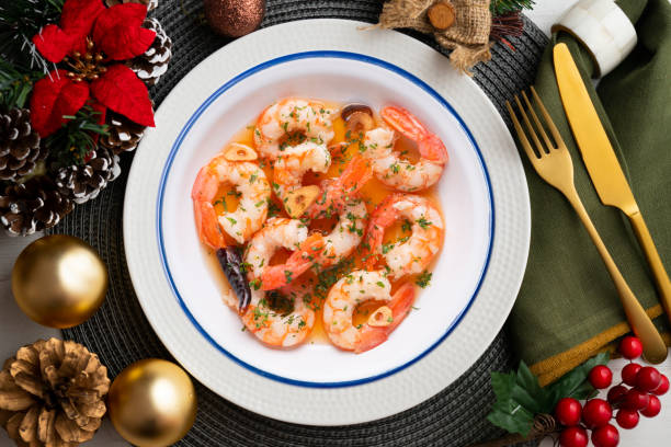 istock Garlic prawn tapas on a table with Christmas decorations. 1431011323