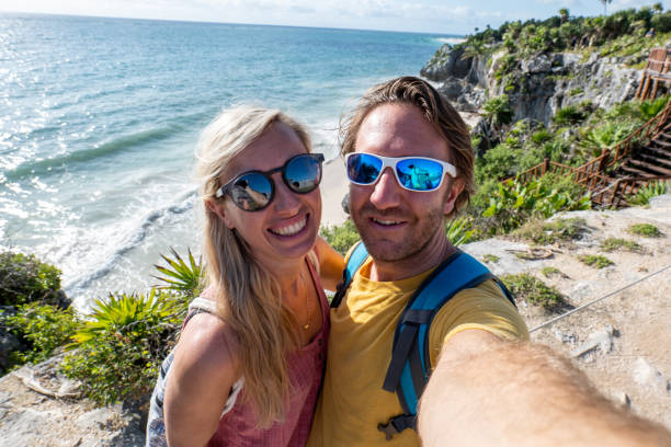 istock Couple take selfie with ancient temple in Mexico 1431013471