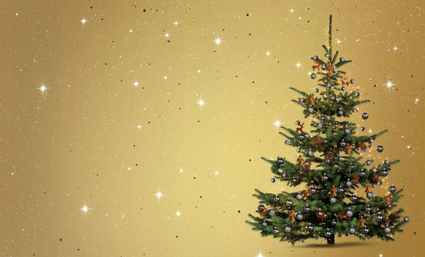 istock Released decorated Christmas tree against golden background 1431013638