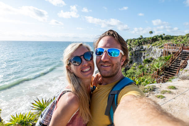 istock Couple take selfie with ancient temple in Mexico 1431013796