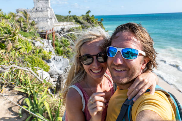 istock Couple take selfie with ancient temple in Mexico 1431013893
