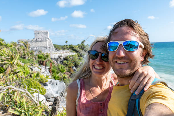 istock Couple take selfie with ancient temple in Mexico 1431014142