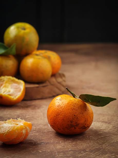 istock Fresh orange fruits with leaves 1431015287