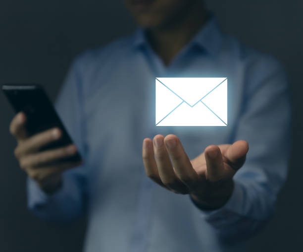 istock Businessman holding mail icon. Electronic mail concept, online communication on the internet network, receiving and sending of data or messages in digital technology. from a smartphone or computer 1431017736