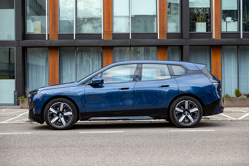 Berlin, Germany - 6th March, 2022: Electric SUV BMW iX on a street. The iX is the largest mass-produced electric SUV from BMW.