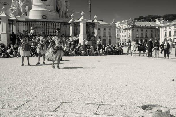 Lisbon, Portugal - May 21, 2022: a group of african dancers, perform at the Praça do Comércio square in Lisbon downtown.