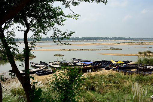 Bardhaman,west Bengal,India 09.30.2022 The colorful riverside landscape of rural west Bengal with fishing boats.
