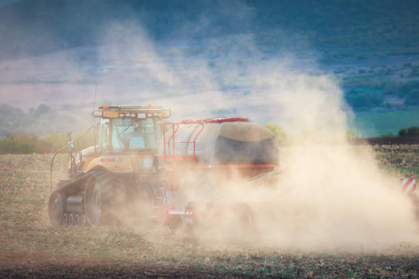 istock Farmer in tractor preparing land with seedbed cultivator 1431027831