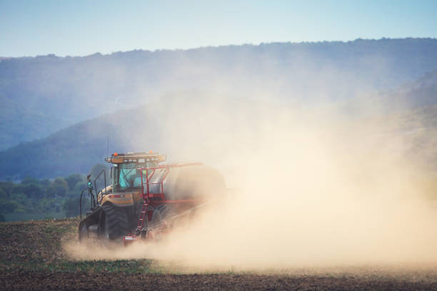 istock Farmer in tractor preparing land with seedbed cultivator 1431027888