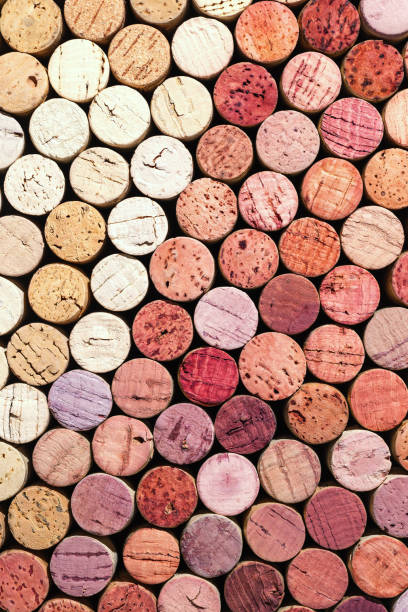 istock Wine cork background from red and white wine, natural texture used bottle stoppers top view. Closeup wooden corks. Natural textured stoppers colored wallpaper. Bright background wine corks 1431027934