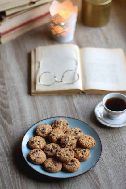 istock Cookies, Tea, Books and Candle 1431029473