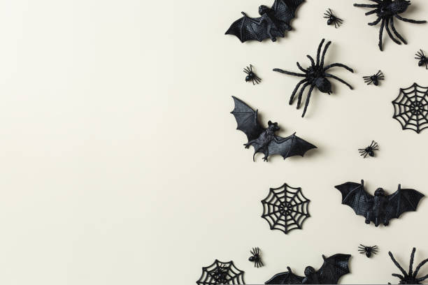 istock Halloween greeting card with bats, spiderweb and spider 1431033450