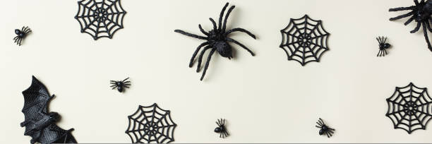 istock Halloween greeting card with bats, spiderweb and spider 1431033580