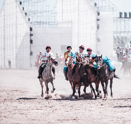 Isyk-Kul, Kyrgyzstan - September ‎29, ‎2018: Kyrgyz men playing Kok Boru – Traditional Kyrgyz Horseback Competition