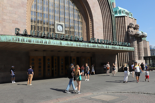 Helsinki, Finland - August 20, 2022: Exterior view of the Helsinki Central railroad station building and its main entrance.