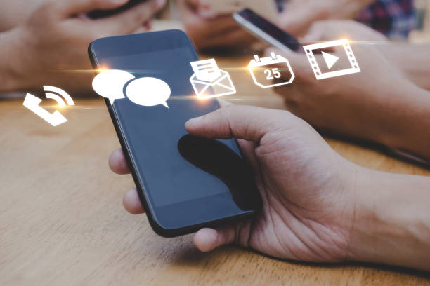 istock Mobile Application. people hand using mobile smart phone with virtual social media icon diagram, contact us, digital marketing, work from home, business finance, internet network technology concept 1431036970