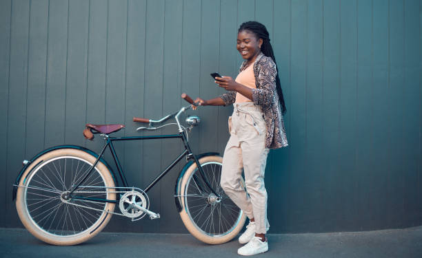 istock Girl, relax with bicycle and using smartphone app, social media and doing a internet or web search. Student uses her bike for health, fun workout or travel by cycling to school, university or college 1431037869