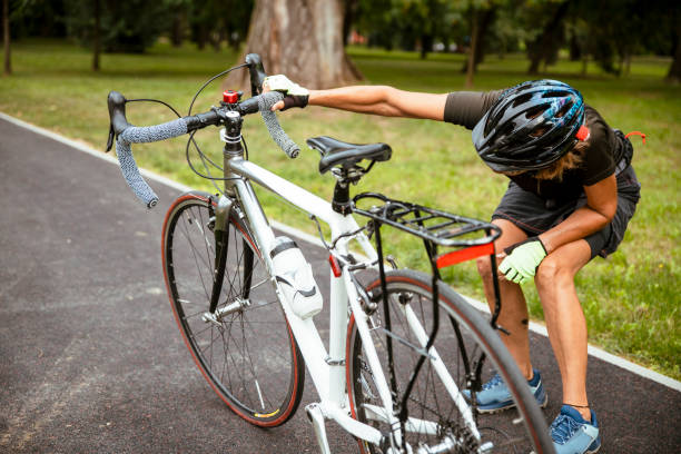istock Elderly female having trouble with broken bicycle outside 1431037949