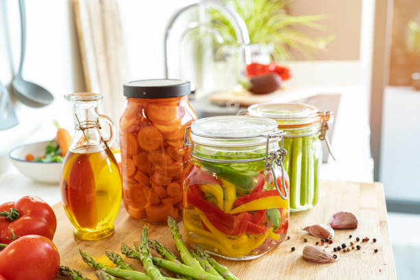 istock Freshly pickled vegetables in jars on kitchen counter 1431038490