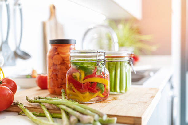istock Freshly pickled vegetables in jars on kitchen counter 1431038548