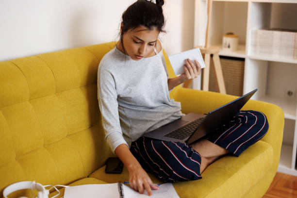 istock Young beautiful woman studying at home 1431038725