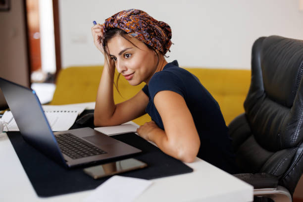 istock Woman Using Laptop At Home 1431039585
