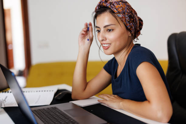 istock Woman Using Laptop At Home 1431040174