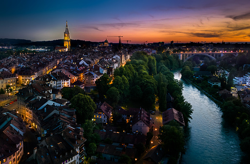 Aerial panoramic drone view of Bern. Sunset time in old european town over the river in Switzerland.