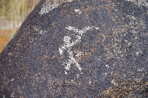 Falconry, hunting scene, man and birds of prey on the stone. VII-III cc. BC. Cholpon Ata petroglyphs, Issyk Kul, Kyrgyzstan