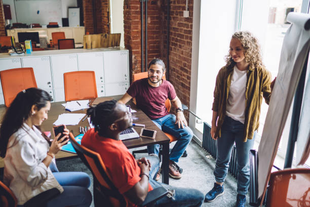 istock Multiethnic contemporary office workers brainstorming together at conference room 1431046481