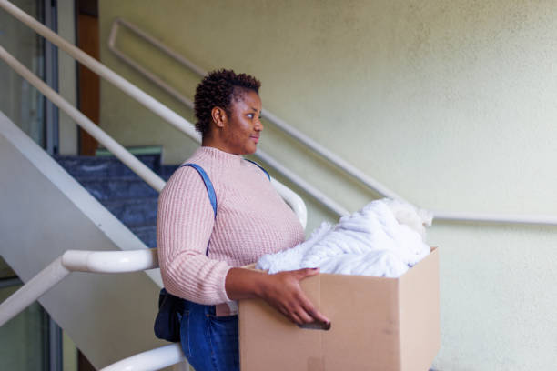 istock Smiling Female College Student Moving Into Dorm 1431046834
