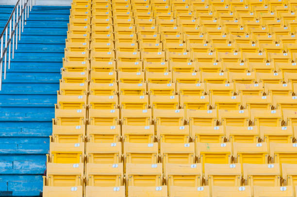 stadium seats on football sport arena with sky background, copy space
