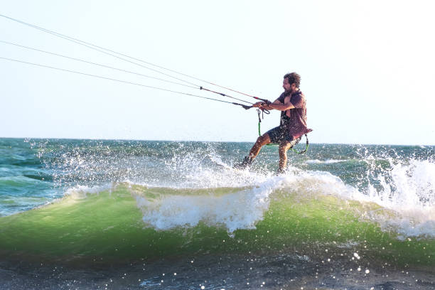 istock Kite surfer rides waves at sunset. Selective focus. 1431055282