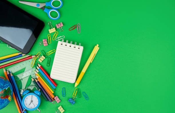 istock School supplies on a green background. Education concept. Back to school. Banner. Copy space. 1431056871