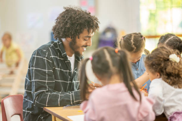 istock Male Childcare Working Facilitating Painting 1431056957