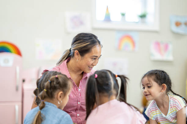 istock Daycare Teacher with Children 1431057032