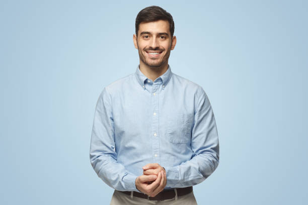 istock Handsome business man standing and showing positive smile to camera, looking confident 1431057954