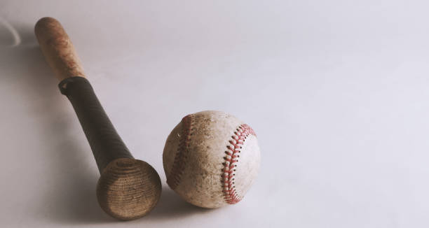 istock baseball bat and ball on white background 1431062488