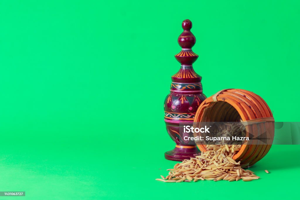 Laxmi puja essentials for rituals kept together. rice paddy grains and other objects symbolizing goddess of riches and prosperity during laxmi puja or makar sankranti in west bengal. Makar Sankranti Stock Photo