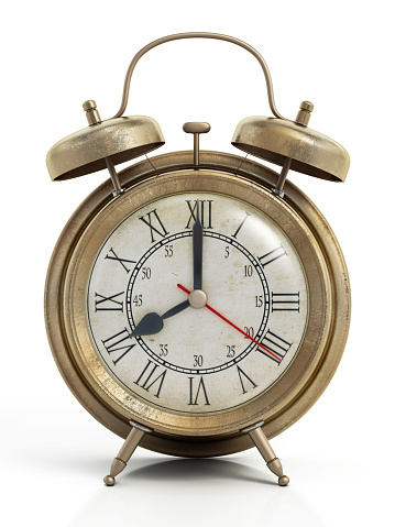 Vintage alarm clock, old style brown and golden clock isolated on white, clipping path