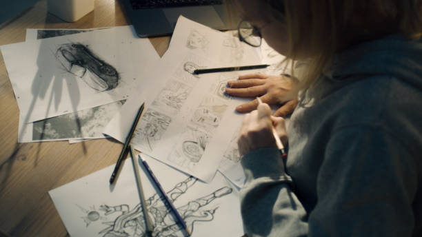 istock Female creative designer works on storyboard and draws sketches for her project 1431066697