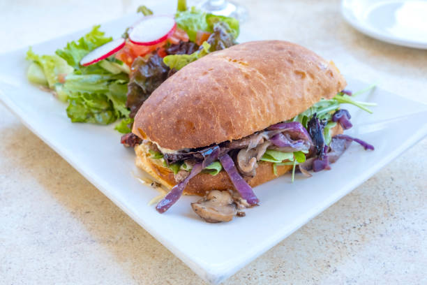 istock Beef Sandwich Served with Salad and Vegetables 1431067175