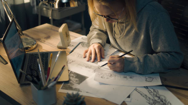 istock Young creative designer walks towards her work desk and starts pencil sketching 1431067211