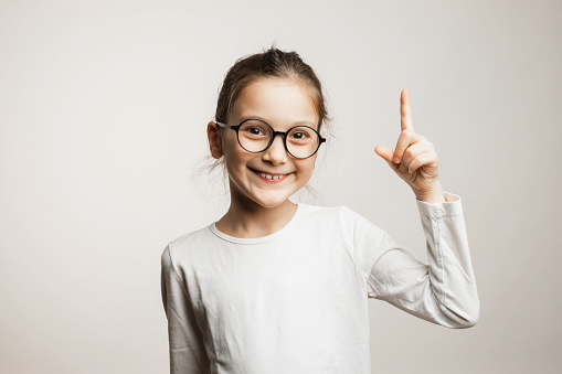 Portrait of a smiling pretty girl isolated over white background