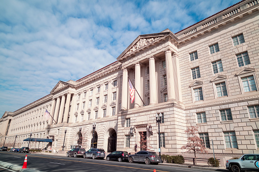 The United States Department of Commerce Herbert C. Hoover Building in Washington, DC, as seen from 15th street NW and Constitution Avenue NW during a sunny winter day.