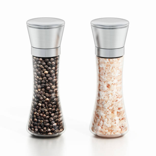 Black pepper and salt shaker or grinders isolated on white.
