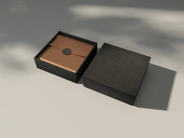 istock Square Black Box Mockup with golden wrapping paper on white table with shadows 1431072757
