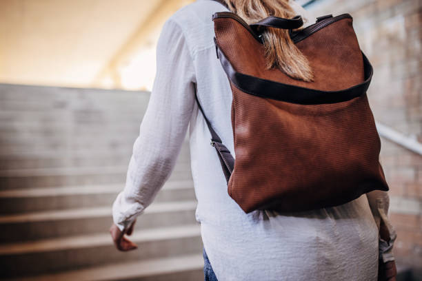 istock Woman walking up the steps 1431072836
