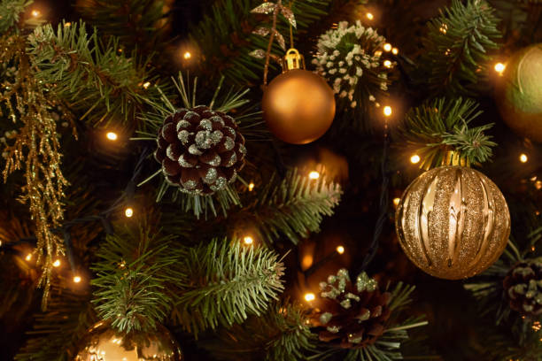 istock Christmas tree decorated with golden balls, cones and lights. Close up. 1431076266